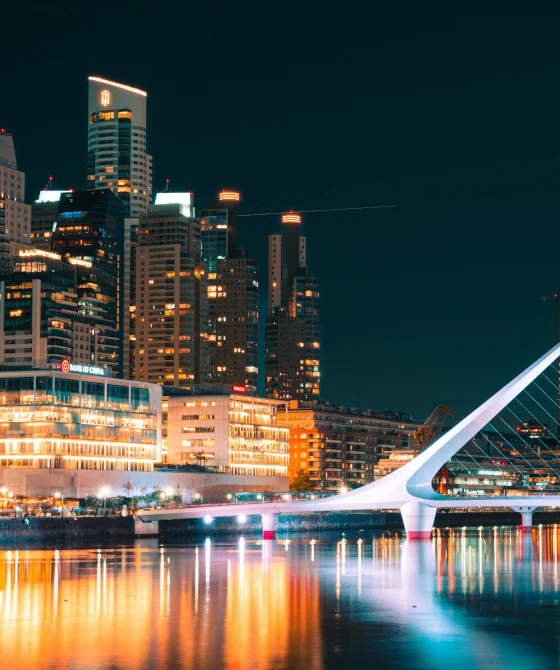 View of Puente de la Mujer and the modern neighborhood of Puerto Madero, Buenos Aires, Argentina, during the night.