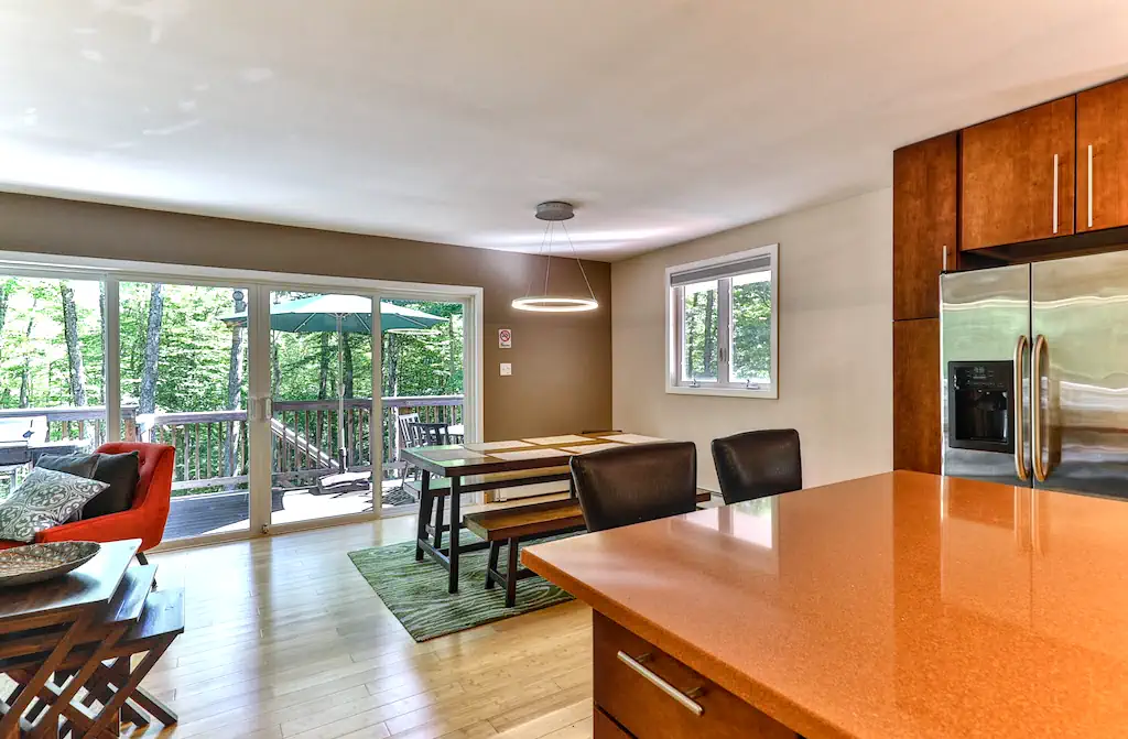 Interior of a vacation home with a view full of trees.